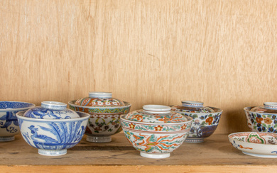 Shelf of Japanese covered porcelain bowls and dish
