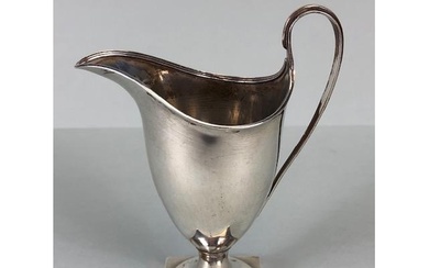 Silver Hallmarked jug on square base looping handle and flut...
