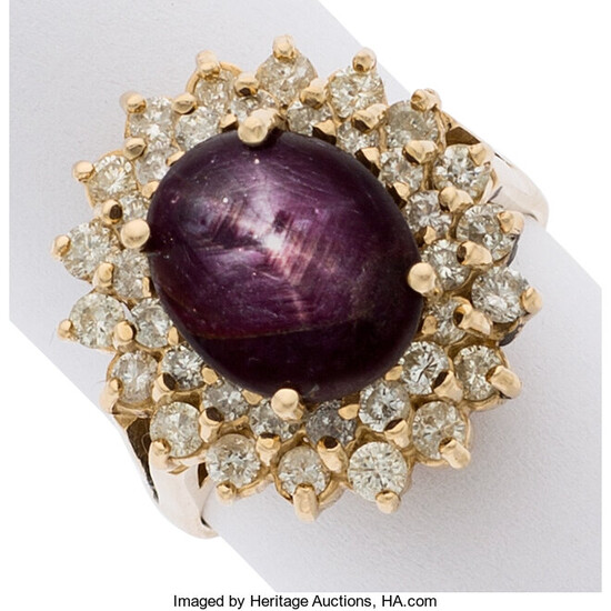 Star Ruby, Diamond, Gold Ring The ring features an...