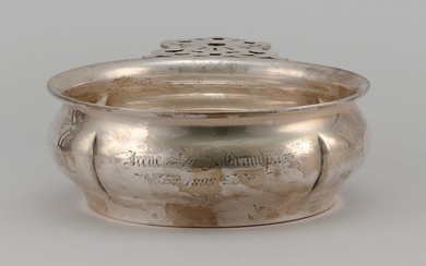 TOWLE REPRODUCTION STERLING SILVER PORRINGER With openwork handle and lobed body. Presentation inscription. Length 8.25". Approx. 9....