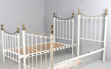 TWO VICTORIAN STYLE CREAM AND GILT METAL SINGLE BED STEADS.