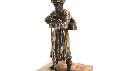 Unknown artist, 19th century: A standing Russian soldier at his gun. A Russian partly silvered brass sculpture. Unsigned. H. 17 cm.