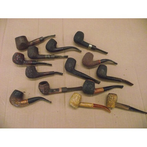 Various vintage carved & textured smokers pipes.