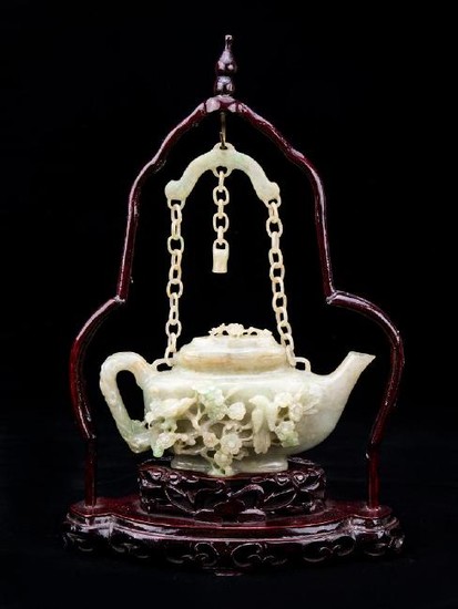 Very rare carved jade tea-pot with wooden hanger
