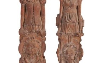 16th Century pair of carved oak terms, of a male and female in Tudor costume above a lion mask and