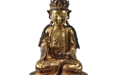 A Chinese gilt-bronze figure of Buddha