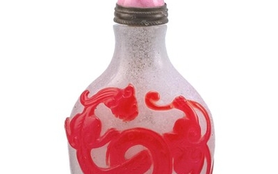 CHINESE OVERLAY GLASS SNUFF BOTTLE In pear shape, with red dragon and bi design on a snowflake ground. Height 2.3". Pink stone stopper.