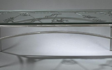 Kokopelli motif, glass-top steel table.