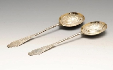 A pair of late Victorian silver fruit serving spoons