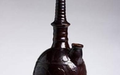 A RUSSET-BROWN-GLAZED CARVED WATER SPRINKLER, KUNDIKA Liao dynasty cm. 41...