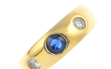 A sapphire and diamond band ring.