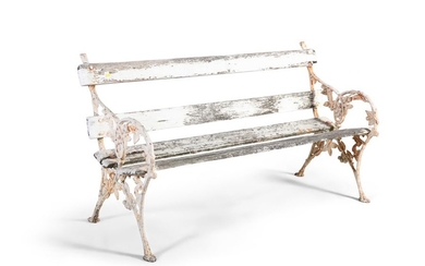 A VICTORIAN WHITE PAINTED CAST IRON GARDEN BENCH, …