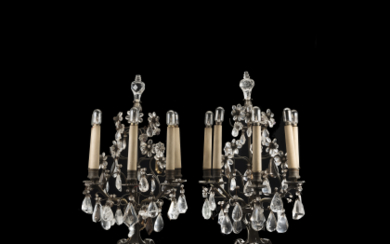 A pair of white metal girandoles with crystal, Rocca crystal and quartz pendant drops. France, 19th century (h. cm 54)...