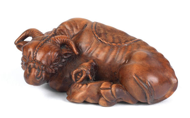A large wood netsuke of a recumbent cow and calf