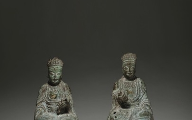 A PAIR OF LARGE CAST-IRON FIGURES OF THE BODHISATTVAS MANJUSRI AND SAMANTABHADRA, KANGXI PERIOD, DATED BY INSCRIPTION TO 1699