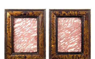 A pair of wooden and tortoise shell frames