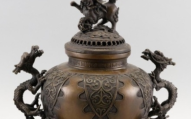 CHINESE BRONZE CENSER In ovoid form, with dragon handles and three lion feet. Domed cover with lion finial. Circular mark on base. H...