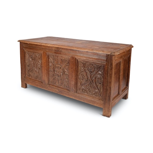 A 17th century carved oak chest The rectangular hinged lid a...