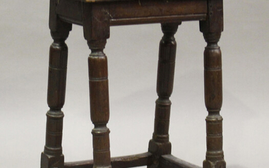 A 17th century oak joint stool, raised on turned and block legs, height 54cm, width 41cm, depth 25.5