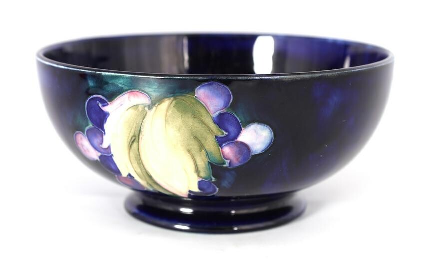 A 1930S MOORCROFT FOOTED BOWL decorated in the Lea