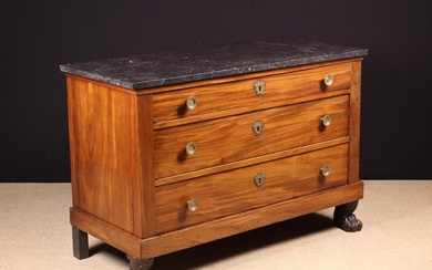 A 19th Century French Mahogany Commode Chest. The rectangular ''petit granit'' marble top above thre