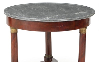 A 19th century French mahogany centre table with gilded bronze fittings, greyish...