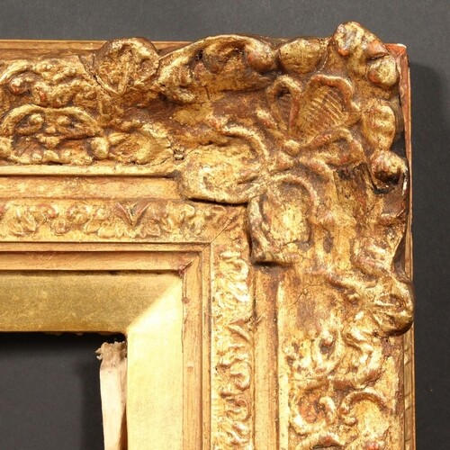 A 20th Century frame with centres and corners, rebate size -...