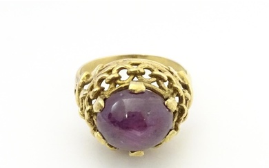 A 9ct gold ring set with ruby cabochon. Ring size approx. O