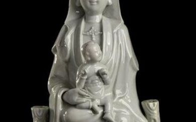 A 'BLANC DE CHINE' PORCELAIN GUANYIN ON THRONE WITH