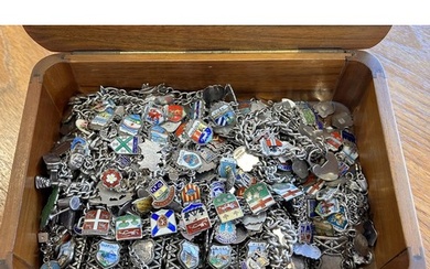 A Box containing approximately 22 silver charm bracelets wit...