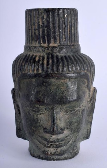 A CAMBODIAN BRONZE BUDDHA HEAD. 12 cm x 6.5 cm.