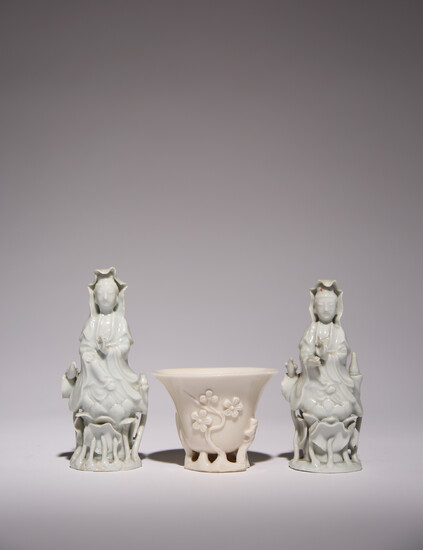 A CHINESE BLANC DE CHINE LIBATION CUP AND TWO WHITE GLAZED FIGURES OF GUANYIN