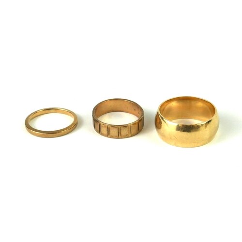 A COLLECTION OF THREE 9CT GOLD WEDDING RINGS To include wide...