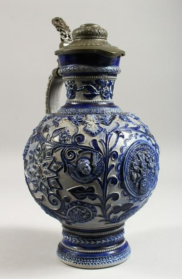 A CONTINENTAL STONEWARE JUG, with blue glazed, moulded