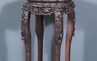 A Chinese Carved Rosewood Octagonal Jardiniere Stand, the top...