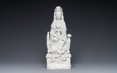 A Chinese Dehua blanc de Chine group of Guanyin with a child and servants, 18th C.
