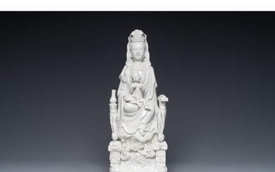 A Chinese Dehua blanc de Chine group of Guanyin with a child...
