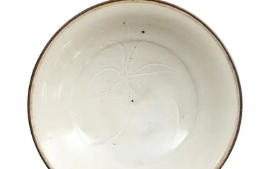 A Chinese 'Ding-style' qingbai-glazed dish Song dynasty The dish thinly potted with...