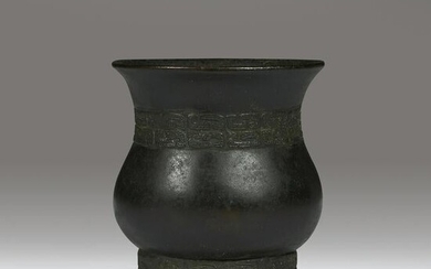 A Chinese archaistic patinated bronze vase, Zun, Ming