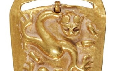 A Chinese gold belt buckle, Han dynasty, chased in high...