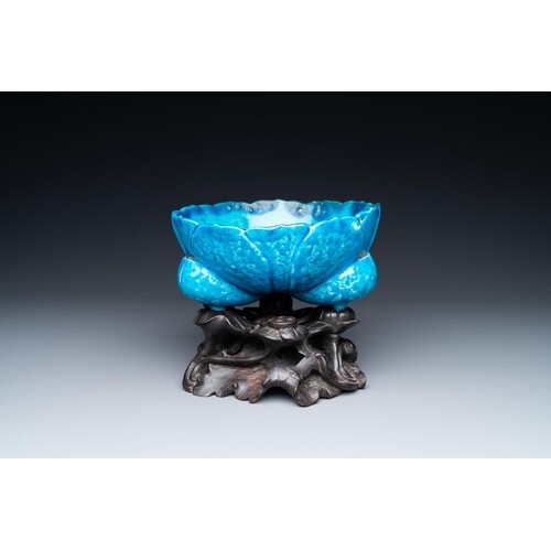 A Chinese monochrome turquoise-glazed flower-shaped tripod b...