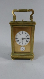 A French Brass Cased Carriage Clock with White Enamel Dial i...