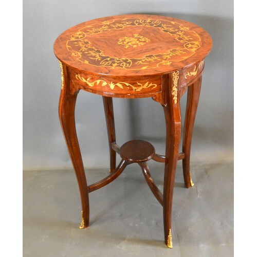 A French style marquetry inlaid gilt metal mounted circular ...