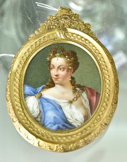 A GERMAN HAND PAINTED PORTRAIT MINIATURE ON PORCELAIN DEPICTING WOMAN IN GILT BRASS OVAL FRAME