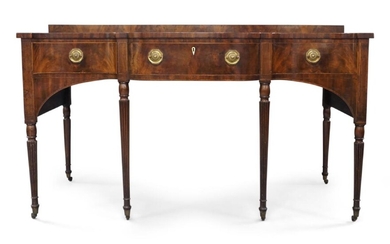 A George III mahogany sideboard, probably Scottish, late 18th century, the serpentine top with raised platform, above a frieze drawer with ivory escutcheon, flanked by one further drawer and one faux, with secret compartment on right side panel...