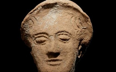 A Greek Terracotta Head Height 10 inches.