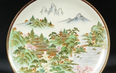A Japanese Satsuma Pottery Dish, finely painted with pagodas...