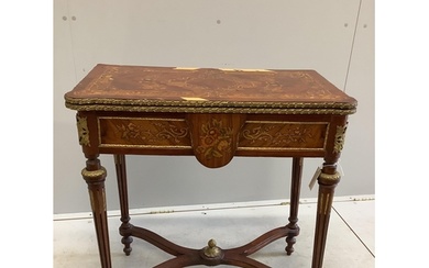 A Louis XVI style gilt metal mounted and marquetry inlaid fo...