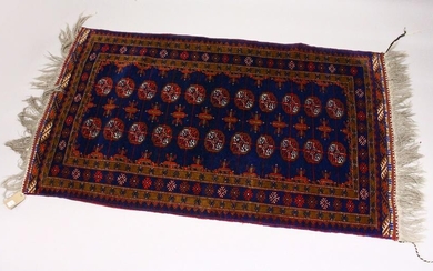 A MODERN BOKHARA STYLE RUG, rich blue ground with two
