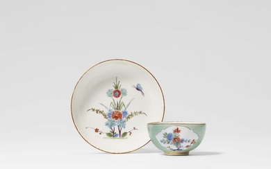 A Meissen porcelain tea bowl and saucer with seafoam green ground and Kakiemon decor